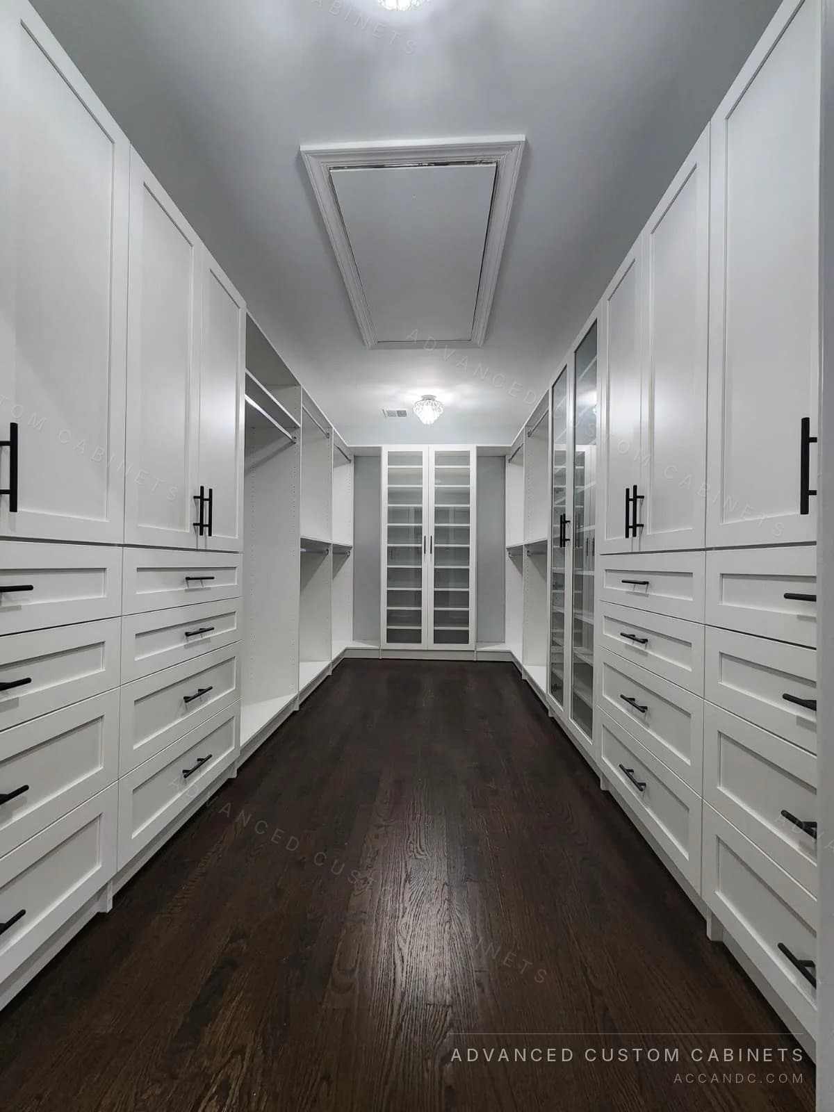 White walk-in closet with glass display cabinet