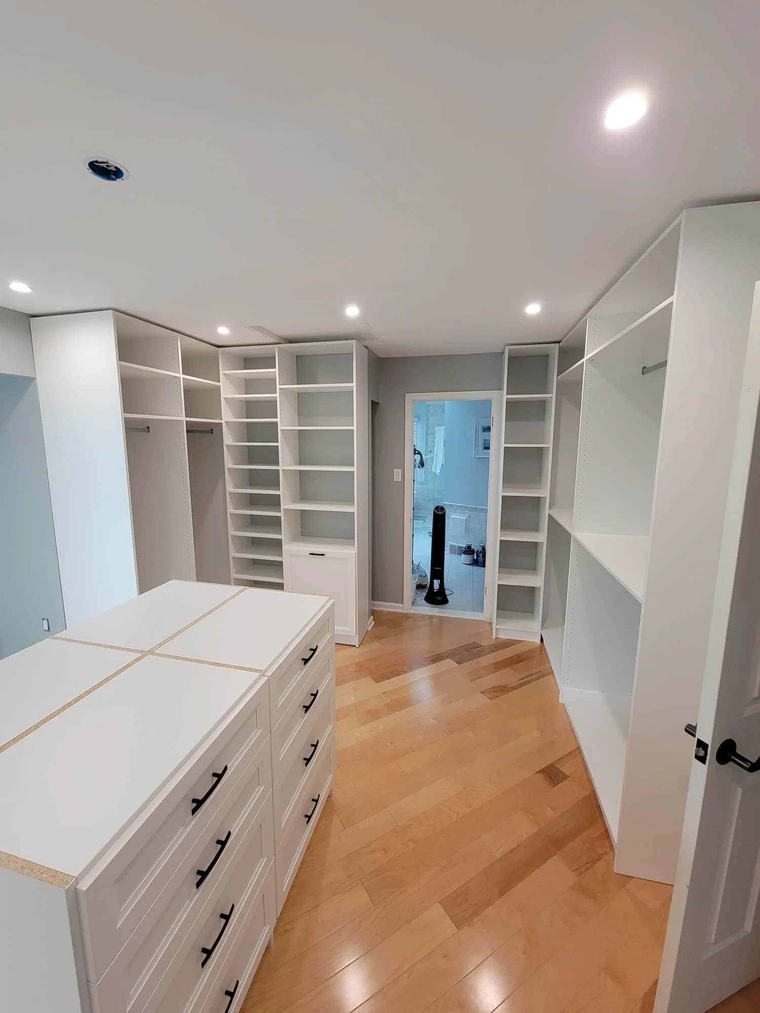White walk-in closet with center island