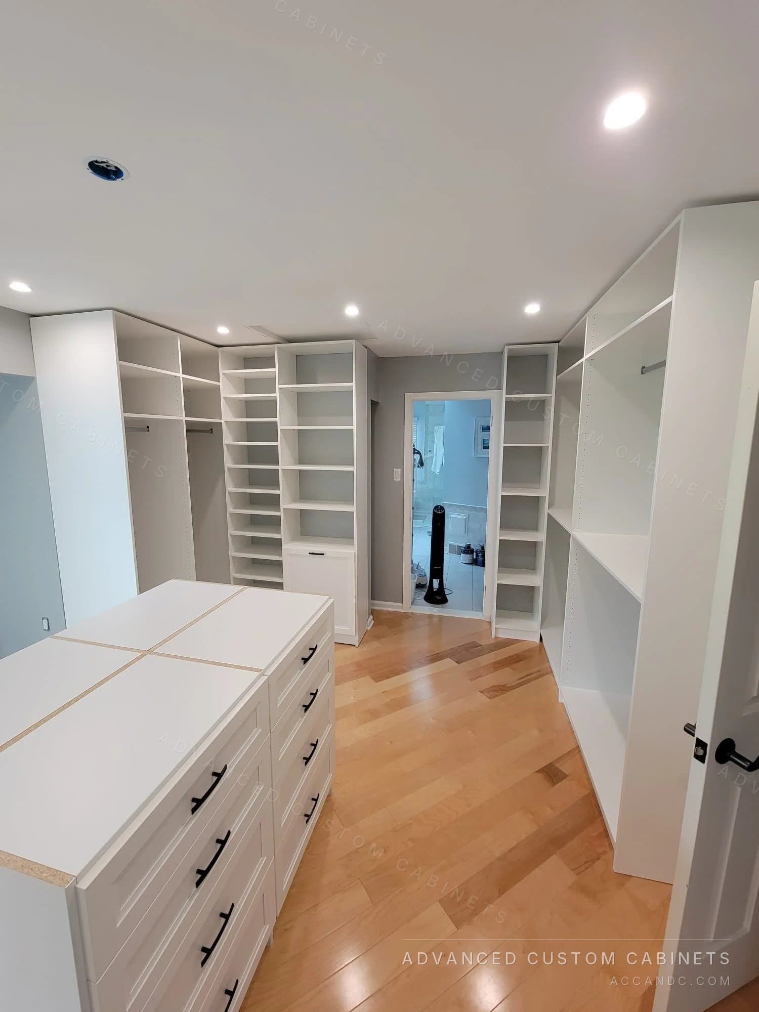 White walk-in closet with center island