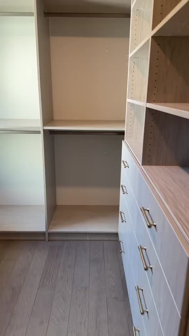 Grey-oak walk-in closet with open shelving, a drawer bank and brass pulls, video walkthrough
