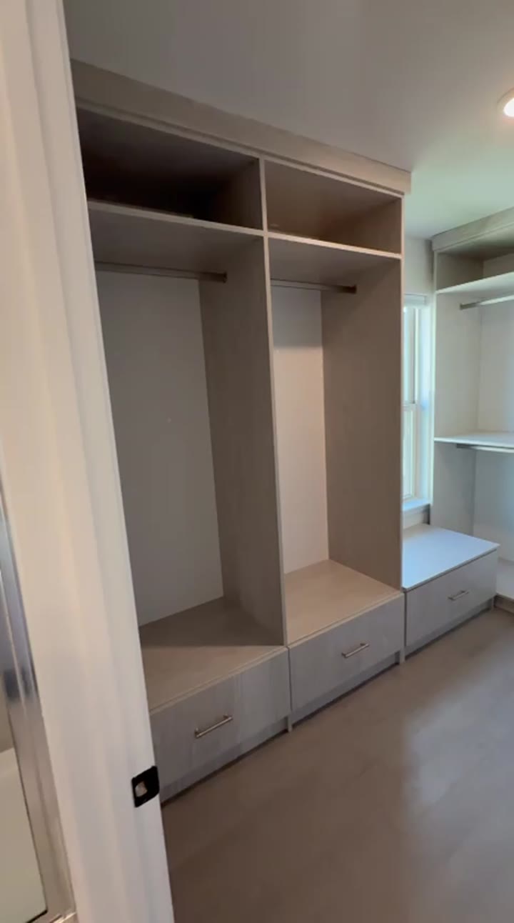 Grey-oak walk-in closet with a window bench and drawer bases, video walkthrough